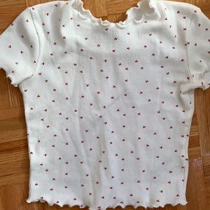 white t-shirt with small cherrys